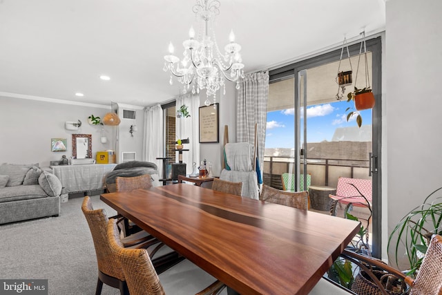 carpeted dining room featuring expansive windows and a chandelier