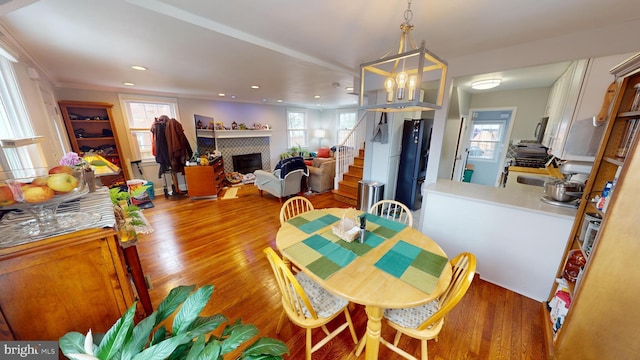 dining space with hardwood / wood-style flooring