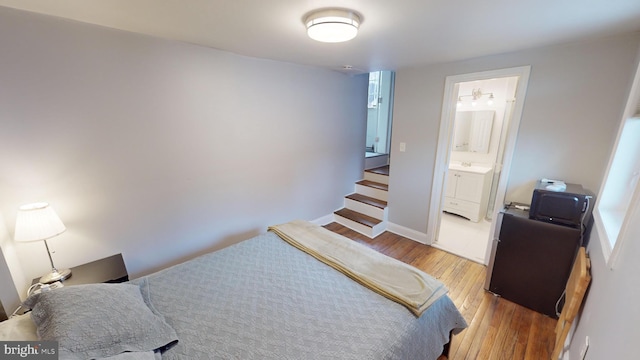 bedroom with light hardwood / wood-style floors