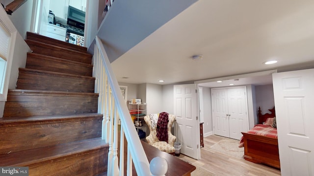 stairway featuring hardwood / wood-style flooring