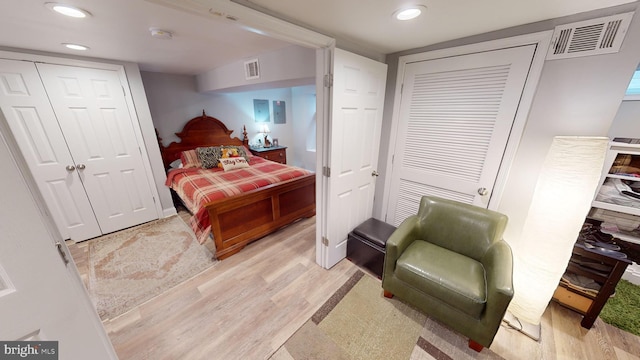 bedroom with light hardwood / wood-style flooring