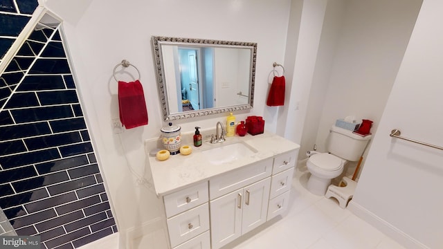 bathroom with vanity, tile patterned floors, and toilet