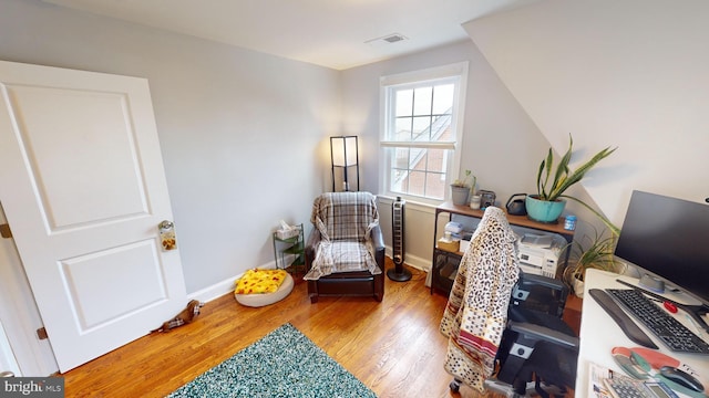 sitting room with light hardwood / wood-style flooring