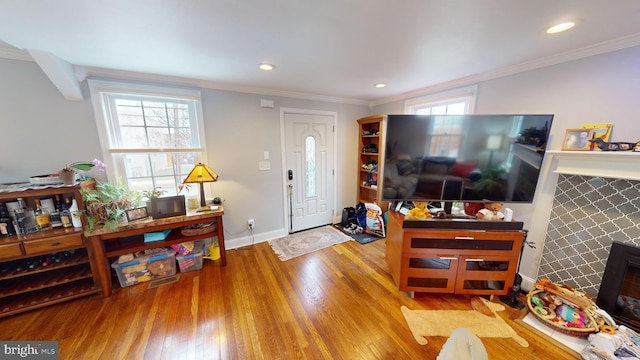 entrance foyer with crown molding and light wood-type flooring