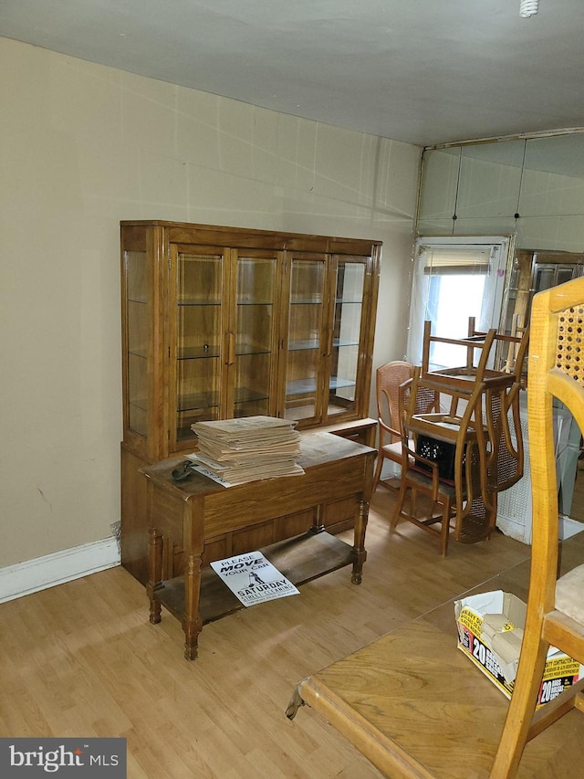 office with light wood-type flooring