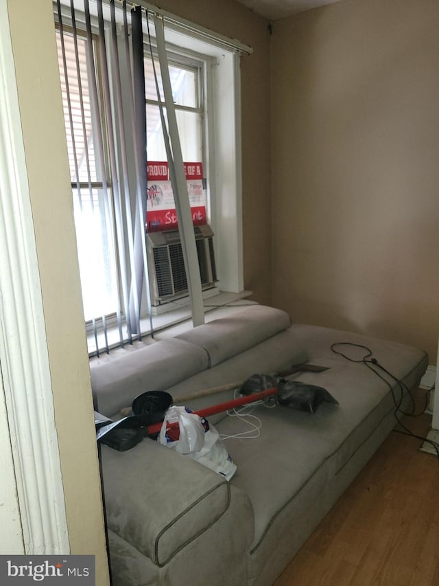 bedroom featuring cooling unit and wood-type flooring