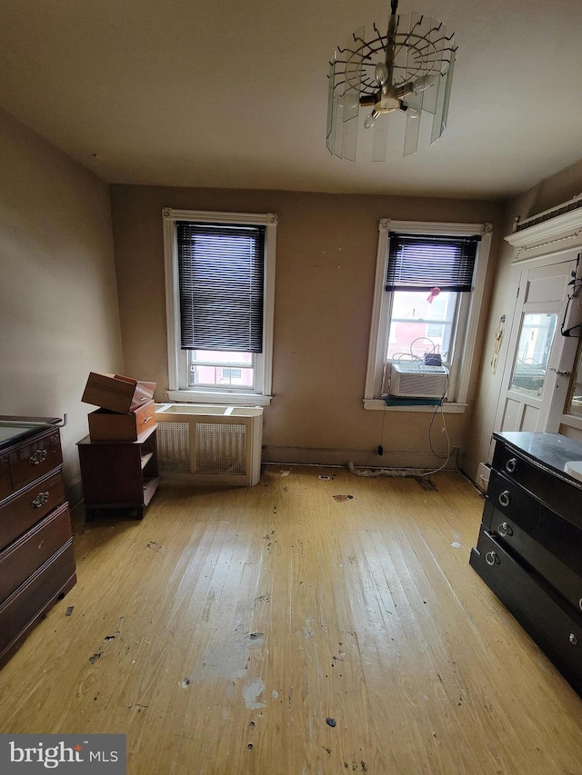 misc room featuring a wealth of natural light, cooling unit, and light hardwood / wood-style floors