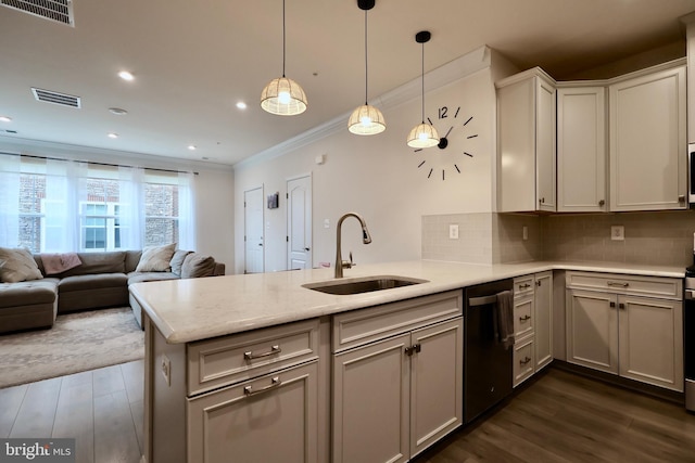 kitchen with black dishwasher, visible vents, open floor plan, a peninsula, and a sink