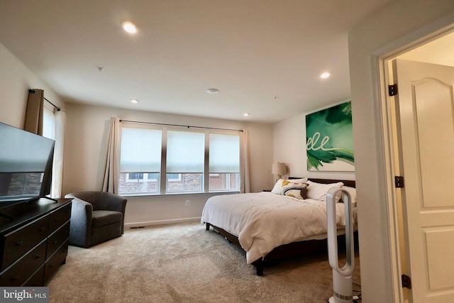 bedroom with recessed lighting, visible vents, baseboards, and light colored carpet