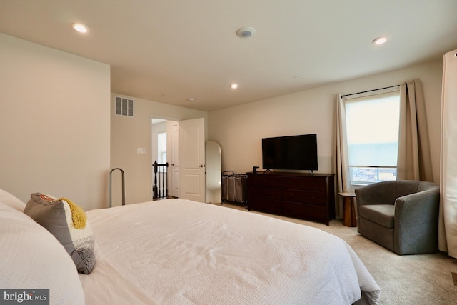 bedroom with recessed lighting, visible vents, and light carpet