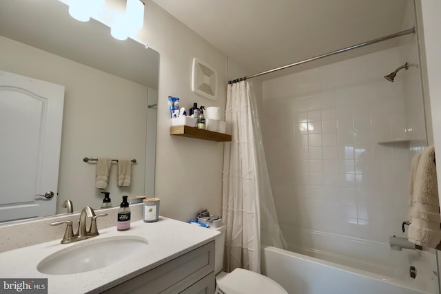 bathroom featuring shower / bath combination with curtain, vanity, and toilet