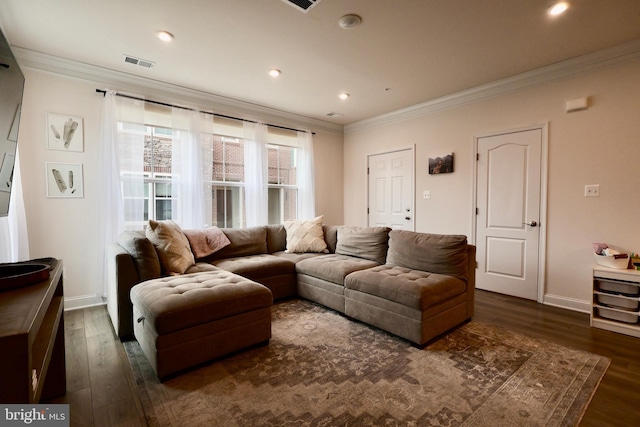 living area featuring baseboards, visible vents, dark wood-type flooring, and crown molding