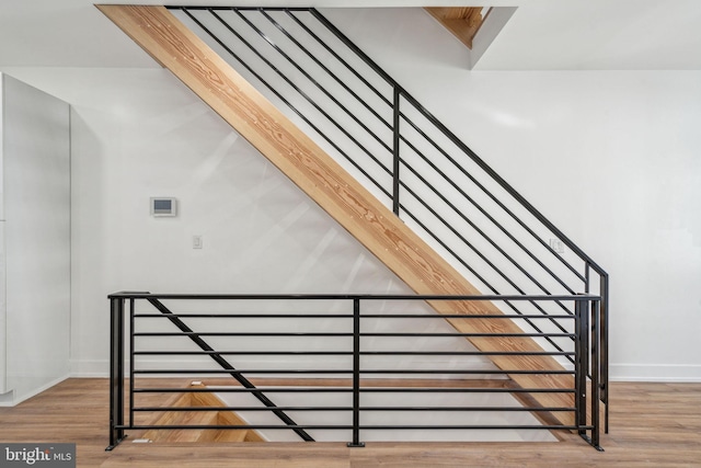 staircase featuring hardwood / wood-style floors