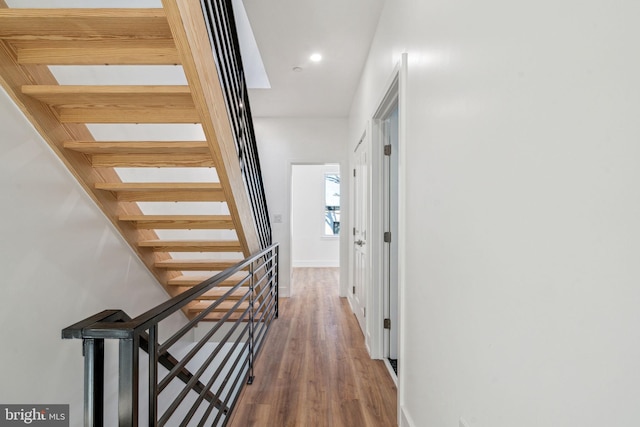 hall with hardwood / wood-style flooring