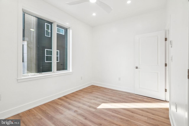 unfurnished room with light wood-type flooring and ceiling fan