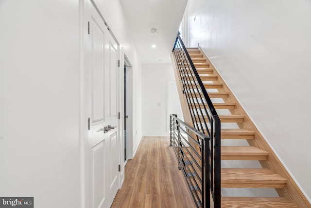 stairs with wood-type flooring