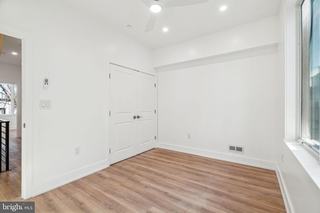 spare room with ceiling fan and light hardwood / wood-style floors