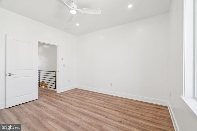 unfurnished room featuring ceiling fan and light hardwood / wood-style flooring