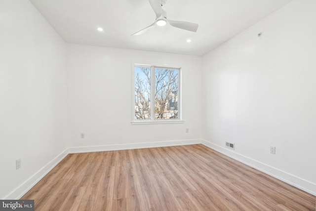 unfurnished room featuring ceiling fan and light hardwood / wood-style flooring