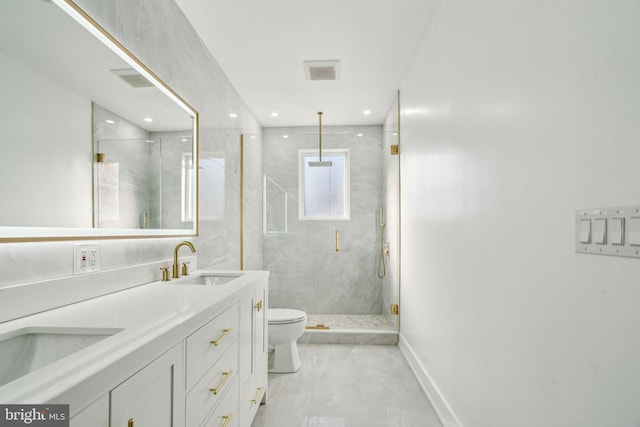 bathroom with vanity, toilet, and walk in shower