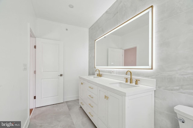 bathroom with toilet and vanity