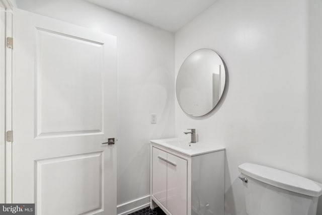 bathroom with toilet and vanity