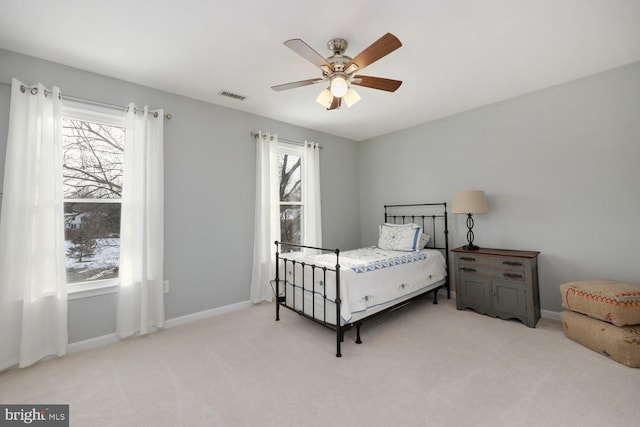 bedroom with ceiling fan and light colored carpet