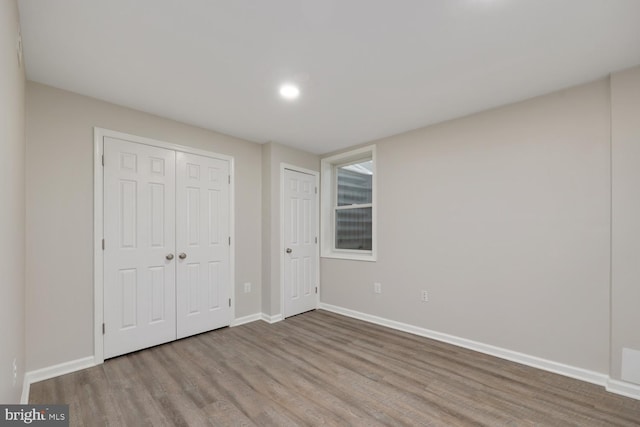 unfurnished bedroom with light hardwood / wood-style flooring