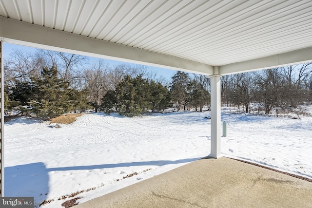 view of yard covered in snow