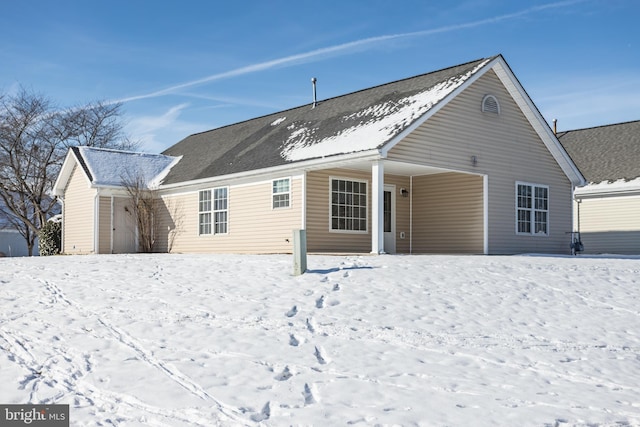 view of snow covered house