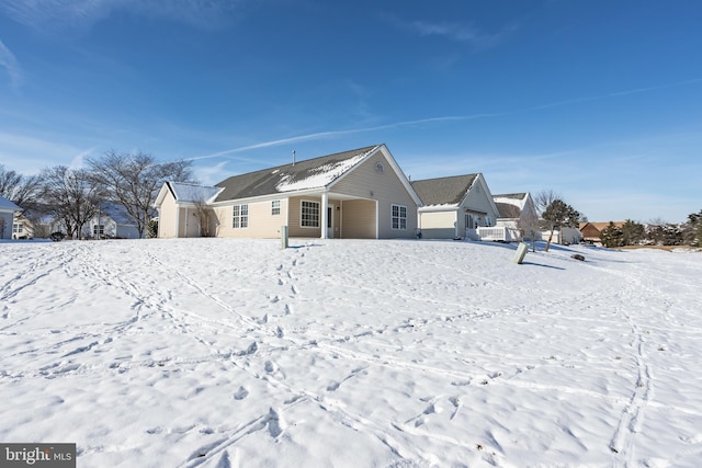 view of snow covered house