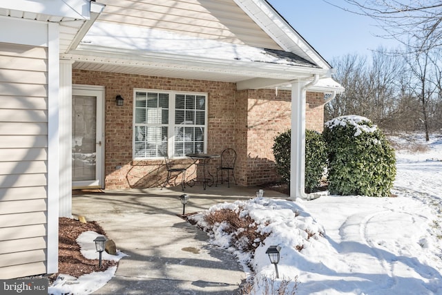 view of snow covered patio