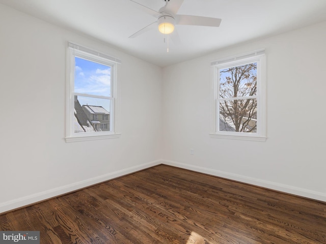 unfurnished room featuring ceiling fan and dark hardwood / wood-style floors