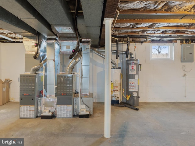 basement featuring electric panel and gas water heater