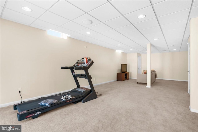 workout area featuring light colored carpet