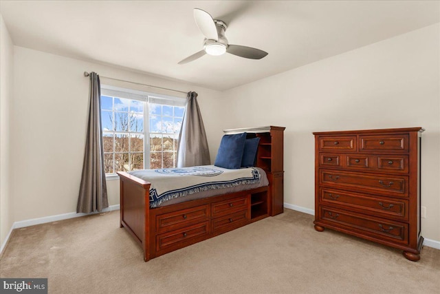 bedroom with ceiling fan and light carpet