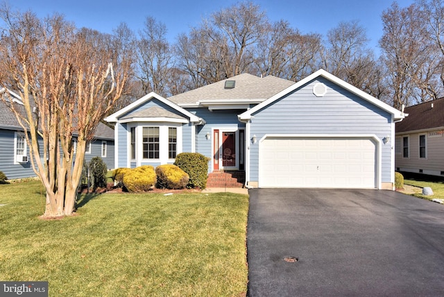 view of front of home with a garage and a front yard