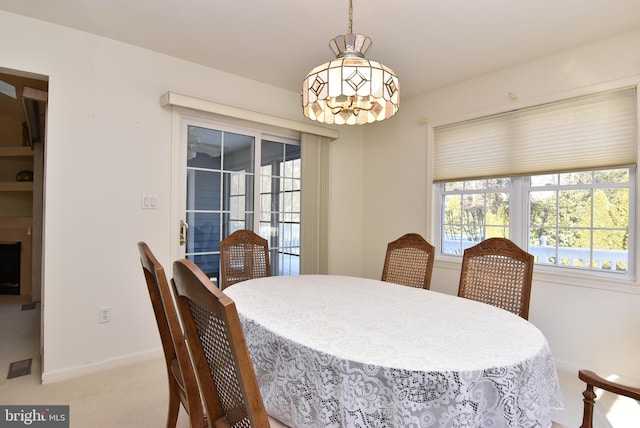 dining room with light colored carpet