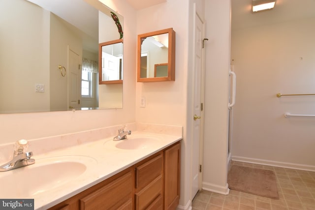 bathroom with vanity and a shower with shower door