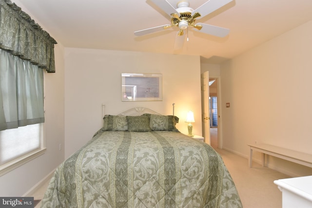 bedroom with ceiling fan and carpet flooring