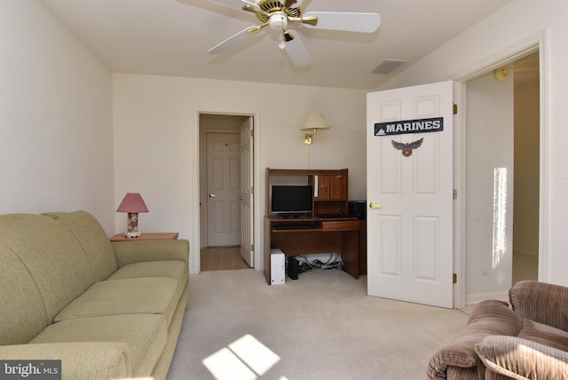 living room with ceiling fan and light colored carpet