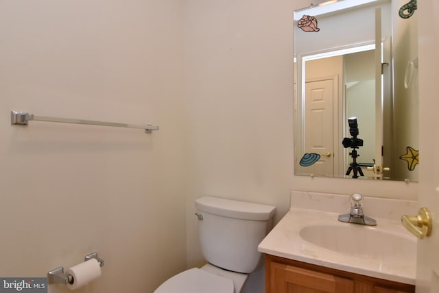 bathroom with vanity and toilet