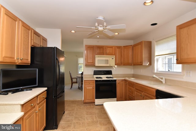 kitchen featuring sink, range with gas stovetop, dishwasher, and ceiling fan