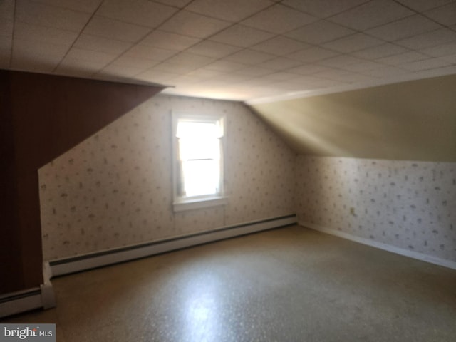 bonus room featuring baseboard heating and vaulted ceiling