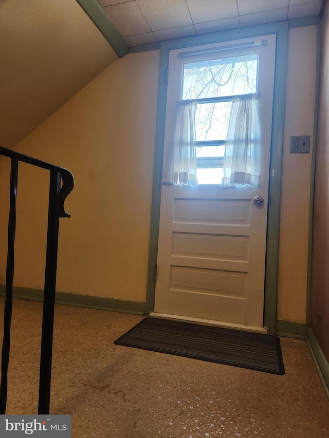 entryway with vaulted ceiling