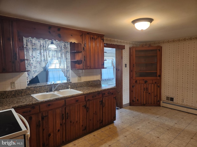 kitchen featuring sink, white electric range oven, decorative backsplash, and a baseboard radiator