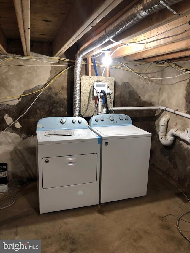 laundry area with washing machine and dryer