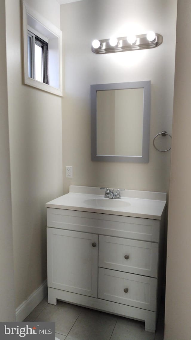 bathroom featuring tile patterned flooring and vanity