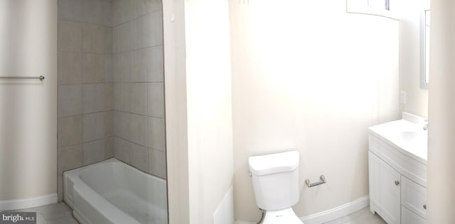 full bathroom with tile patterned floors, toilet, vanity, and tiled shower / bath combo