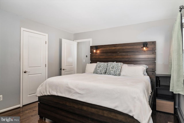 bedroom featuring dark wood-type flooring